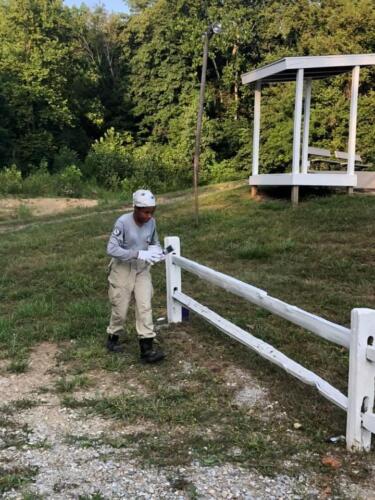 Volunteer Painting Fence